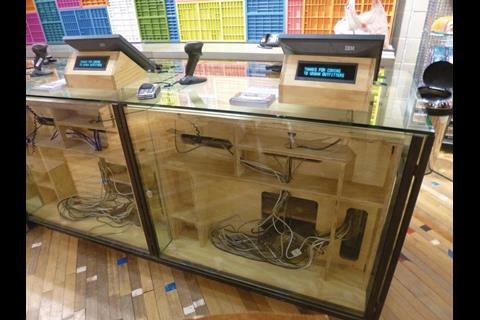 Glass-fronted cash desks reveal the inner wires of the tills